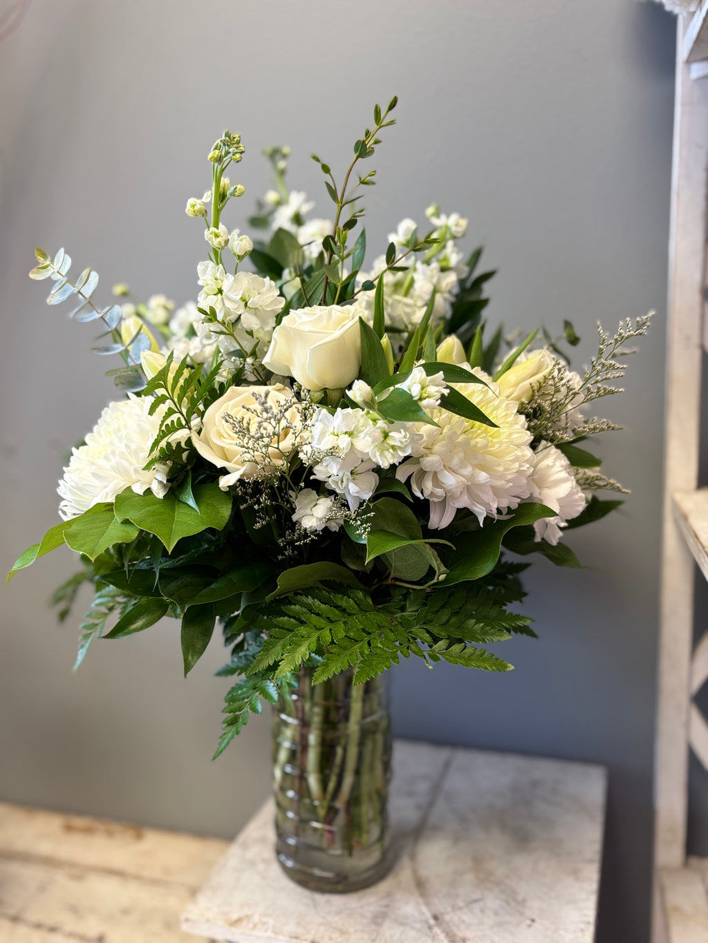 Ever After is a timeless, all-white floral arrangement of lilies, chrysanthemum and roses designed to bring peace, express sympathy and celebrate eternal life. Delivery to Hamilton and Burlington Funeral Homes. 