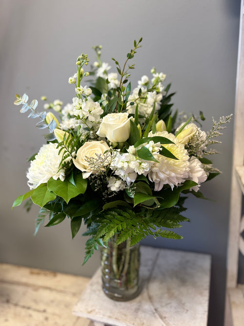 Ever After is a timeless, all-white floral arrangement of lilies, chrysanthemum and roses designed to bring peace, express sympathy and celebrate eternal life. Delivery to Hamilton and Burlington Funeral Homes. 