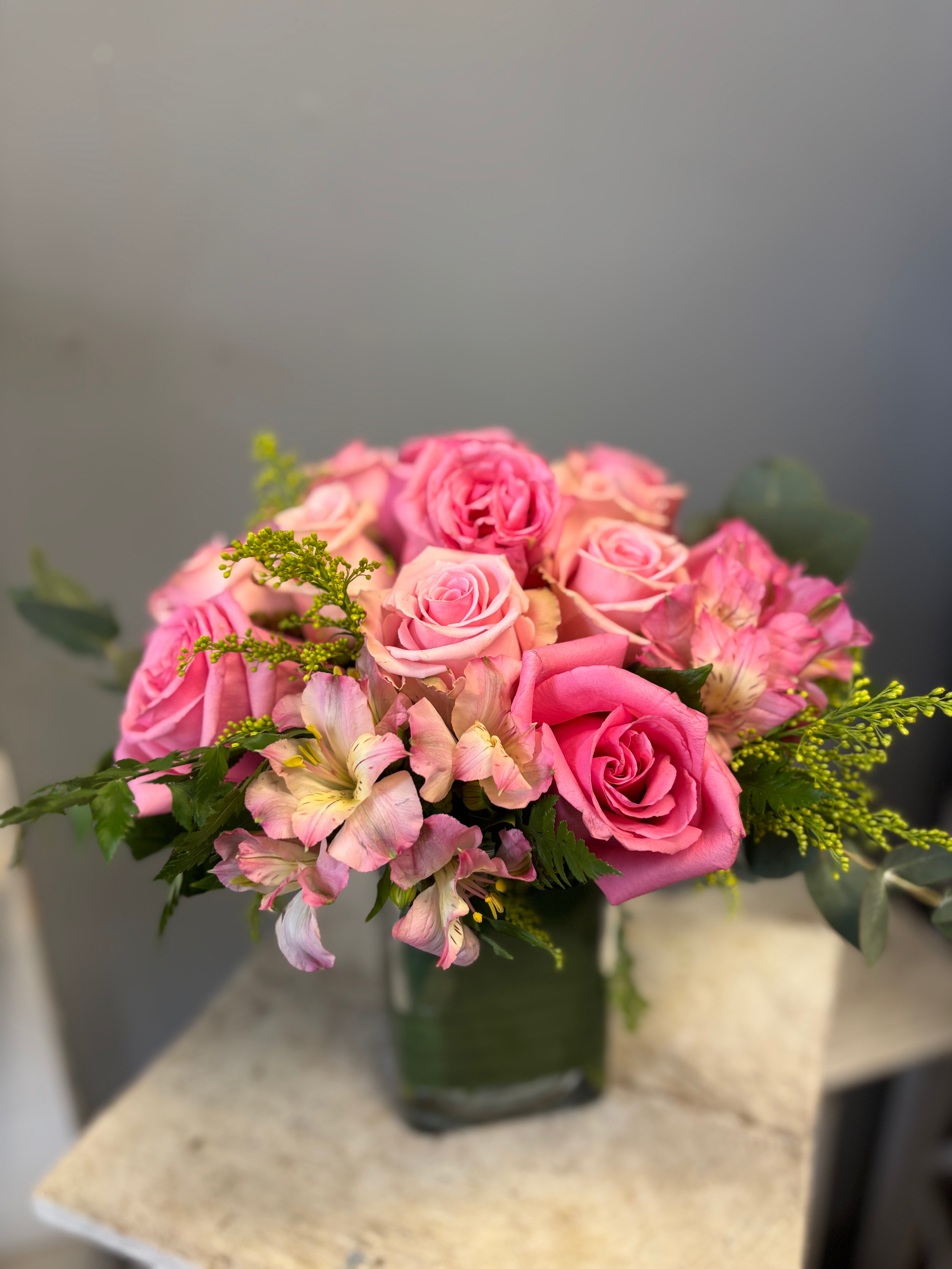 Sweet, feminine, and effortlessly giftable, Petite Pink blends soft blush tones with fresh greens for a design that feels warm and joyful. Often featuring roses and seasonal pink blooms, this arrangement is a favourite for birthdays and thoughtful surprises.
A charming classic from your Hamilton flower studio.