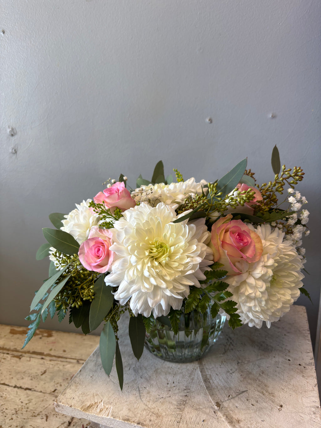 Romantic, lush, and layered with soft textures, Safe Haven is designed to feel abundant and elegant without being overwhelming. Featuring seasonal blooms such as roses, lilies, and fresh greenery when available, this arrangement brings a gentle richness to any room.
A lovely choice for celebrations, anniversaries, and heartfelt moments.
